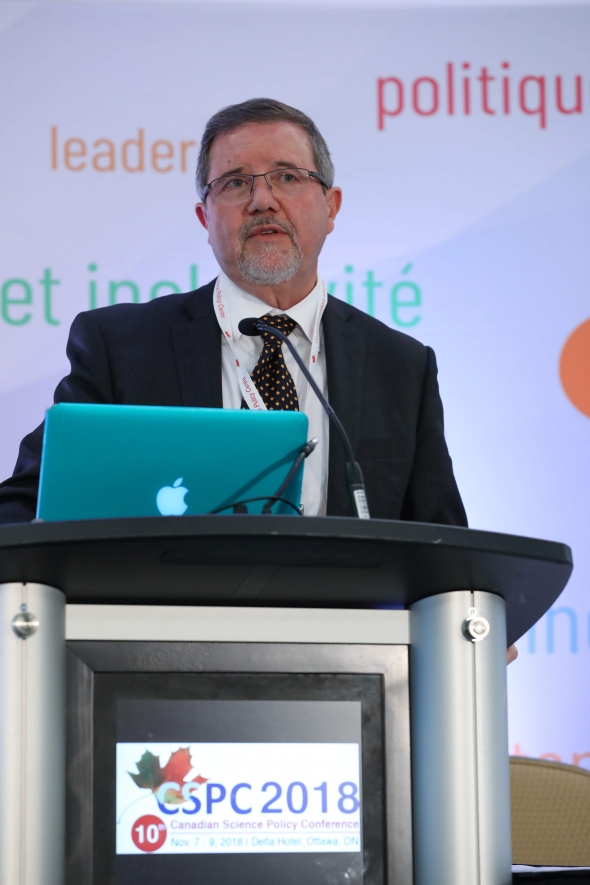 man talking at conference