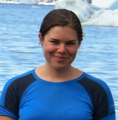 photo of a white woman in front of an artic bay