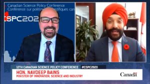 Screengrab and on interview with a white man in glasses (Mehrdad Hariri) and a sikh man in a turban (Navdeep Bains)