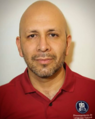 Photo of a bald man in a red polo shirt